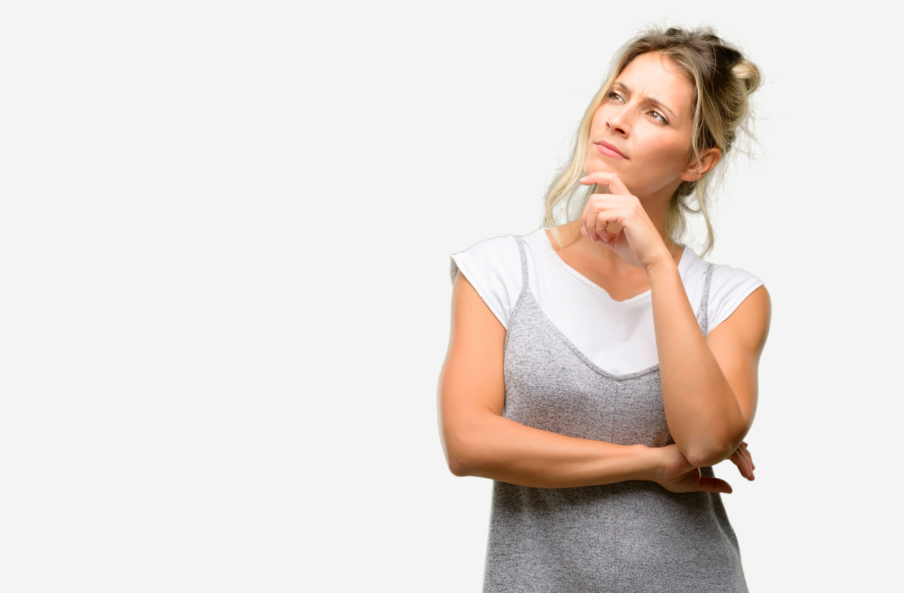 Young beautiful woman thinking and looking up expressing doubt and wonder
